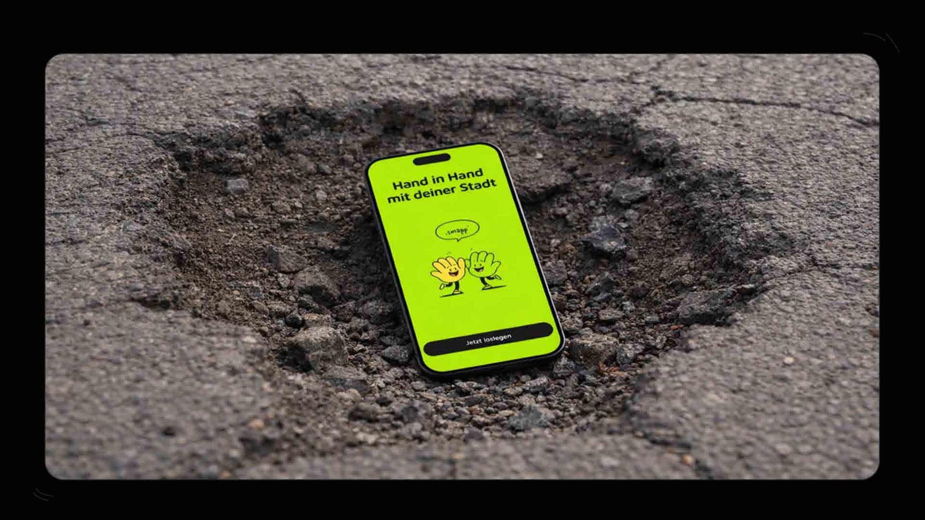smapp brand moment, phone on a real pothole showing the welcome screen 'Hand in hand with your city'